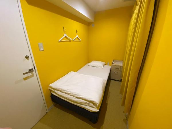 Hostel Anchorage : photo 4 de la chambre chambre simple avec toilettes et douche communes