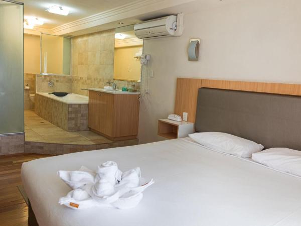 Indian Ocean Hotel : photo 1 de la chambre suite de luxe avec baignoire spa