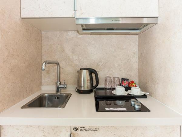 Sanya Phoenix Island Yuejia flat : photo 10 de la chambre chambre lit king-size - vue sur mer