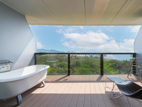 Sanya Phoenix Island Yuejia flat : photo 1 de la chambre chambre lit king-size - vue sur mer