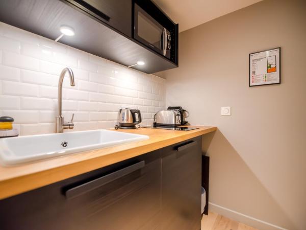 Residence Les Boulevards : photo 5 de la chambre studio lit queen-size