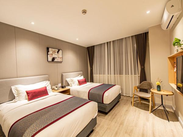 Shanghai JOYFUL YARD Hotel-Free shuttle bus from Pudong Airport and Disneylan : photo 4 de la chambre chambre lits jumeaux deluxe