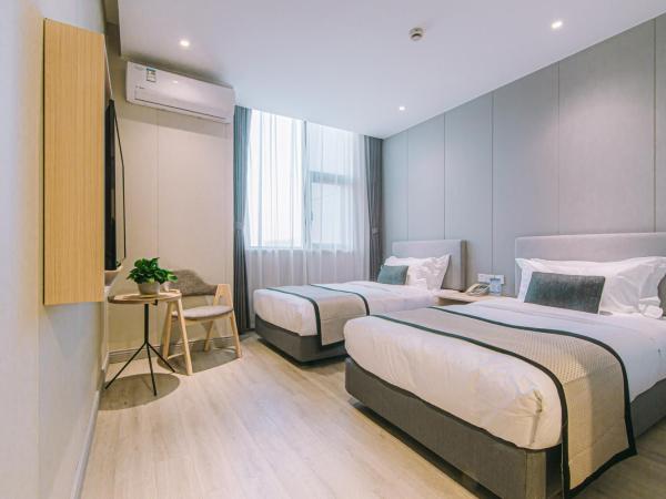 Shanghai JOYFUL YARD Hotel-Free shuttle bus from Pudong Airport and Disneylan : photo 2 de la chambre chambre lits jumeaux standard