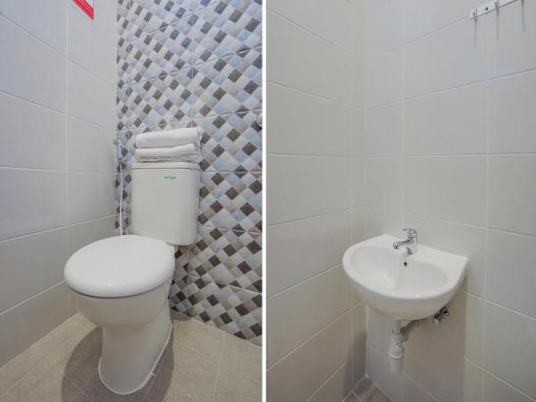 Super OYO Capital O 90336 Olive Guest House : photo 8 de la chambre chambre double deluxe