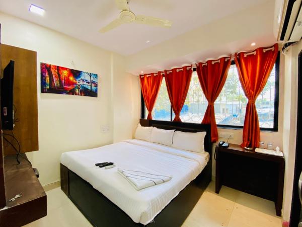 Deluxe Inn - Stay Near Kokilaben Dhirubhai Ambani Hospital : photo 1 de la chambre chambre double Économique
