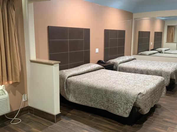 Sterling Inn and Suites at Reliant and Medical Center Houston : photo 1 de la chambre chambre avec 2 grands lits queen-size