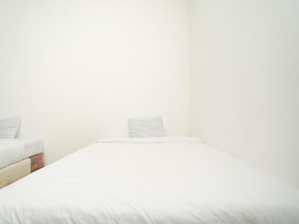 Merapi Inn Surabaya by ecommerceloka : photo 5 de la chambre chambre lits jumeaux standard