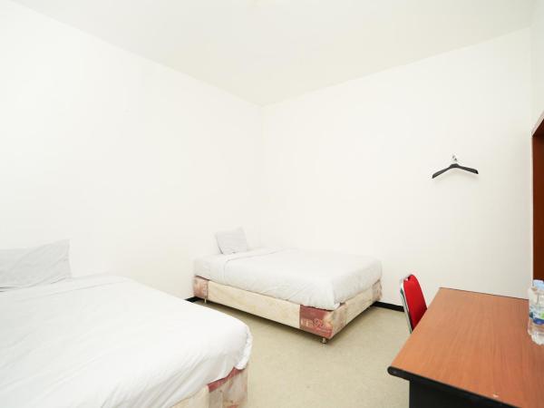 Merapi Inn Surabaya by ecommerceloka : photo 3 de la chambre chambre lits jumeaux standard