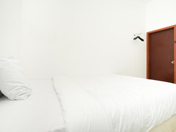 Merapi Inn Surabaya by ecommerceloka : photo 10 de la chambre chambre lits jumeaux standard