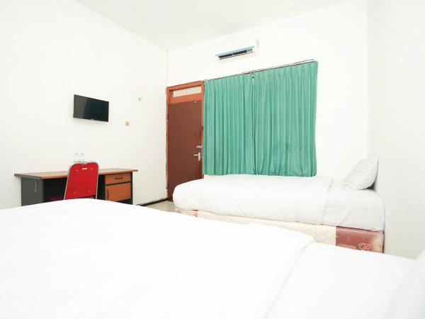 Merapi Inn Surabaya by ecommerceloka : photo 2 de la chambre chambre lits jumeaux standard