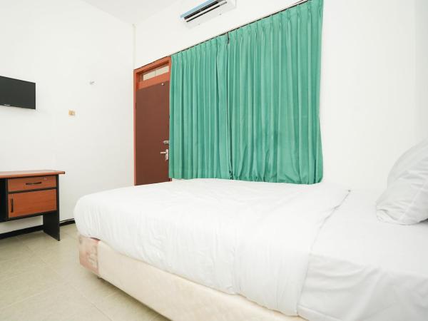 Merapi Inn Surabaya by ecommerceloka : photo 1 de la chambre chambre lits jumeaux standard