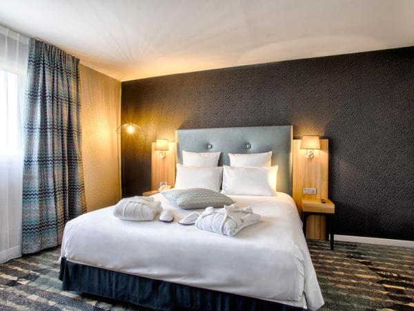 Mercure Cabourg Hôtel & Spa : photo 2 de la chambre suite privilège avec 1 lit double et 1 canapé-lit