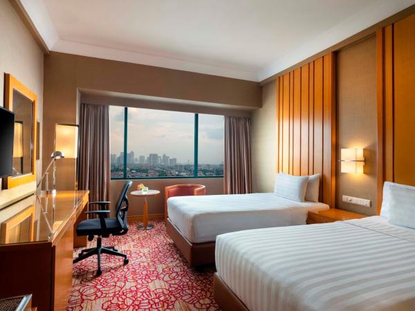 Hotel Ciputra Jakarta managed by Swiss-Belhotel International : photo 1 de la chambre chambre lits jumeaux deluxe