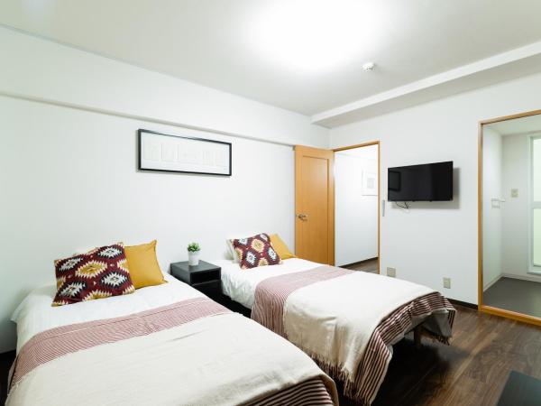 GuestHouse MIYABI : photo 2 de la chambre chambre lits jumeaux avec salle de bains privative