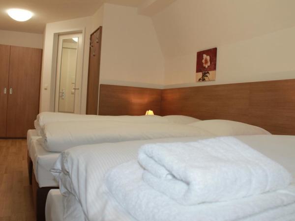 Apartment Hotel am Sand : photo 8 de la chambre chambre triple