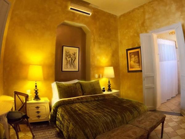 La Perla Hotel Boutique B&B : photo 1 de la chambre chambre lit queen-size avec balcon