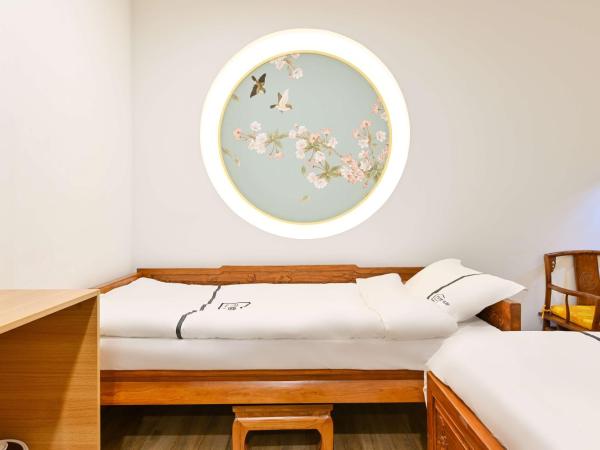 Xingshe Alley Courtyard Hotel Beijing Wangfujing Forbidden City Branch : photo 4 de la chambre chambre triple