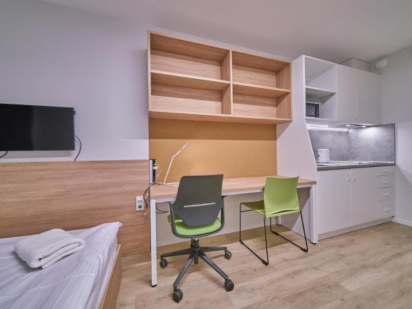 Apartamenty Collegia : photo 1 de la chambre petite chambre double