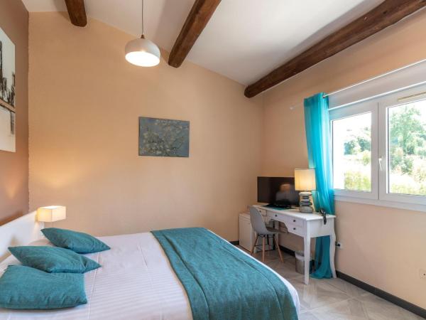 Les Bastides Saint Paul : photo 1 de la chambre chambre triple confort