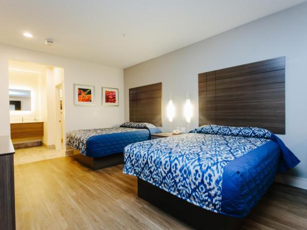 Palace Inn Blue City Centre : photo 2 de la chambre chambre supérieure avec 2 lits queen-size