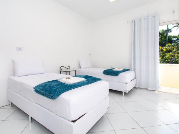 Pousada Casuarina Ferradura : photo 3 de la chambre chambre quadruple