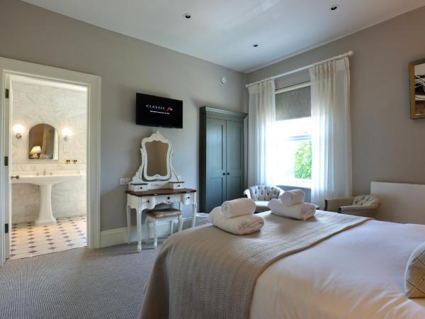 Tyndall Villa Boutique B&B : photo 2 de la chambre hébergement lit king-size de luxe - ville