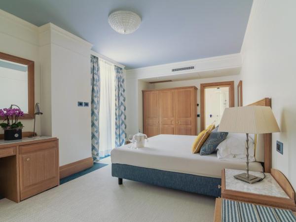 Casa Bianca Al Mare : photo 1 de la chambre chambre double ou lits jumeaux supérieure - vue sur jardin