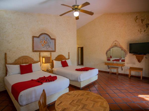 Hosteria Las Quintas Hotel Restaurante Bar : photo 10 de la chambre suite avec 2 lits doubles et baignoire spa