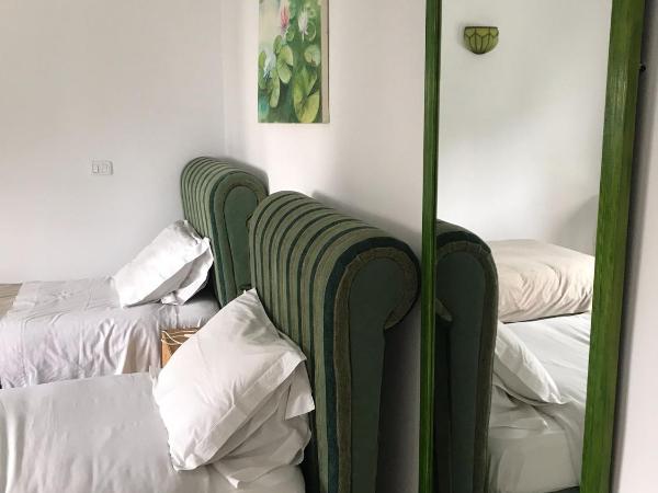 Villa Phoenicia : photo 1 de la chambre chambre lits jumeaux smeraldo 