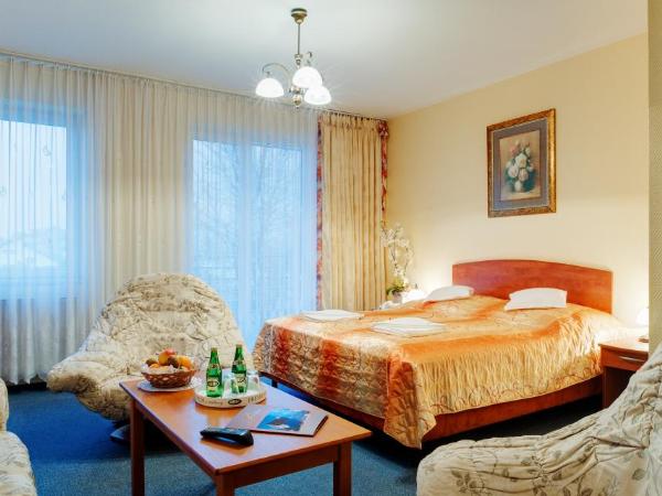 Ośrodek Perełka : photo 1 de la chambre chambre double deluxe (2 adultes + 1 enfant)