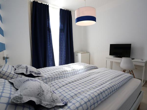 Guesthouse Villa Maggie : photo 2 de la chambre chambre lits jumeaux avec terrasse