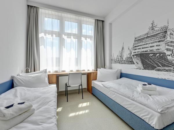 Apartgdynia : photo 2 de la chambre chambre quadruple