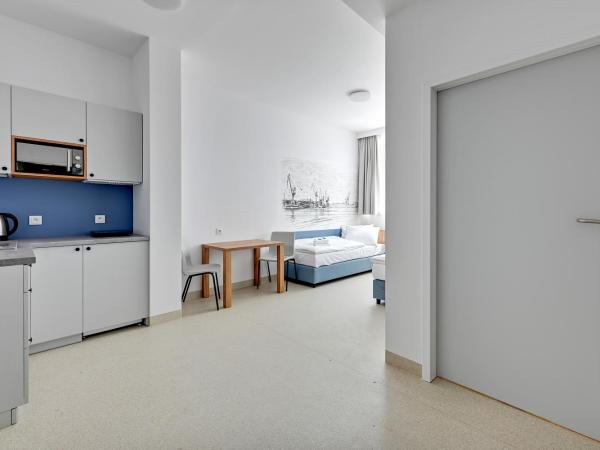 Apartgdynia : photo 3 de la chambre chambre quadruple