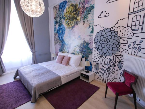 Uránia Apartmanház : photo 7 de la chambre appartement en duplex