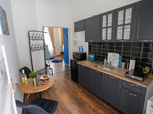 Uránia Apartmanház : photo 10 de la chambre appartement deluxe