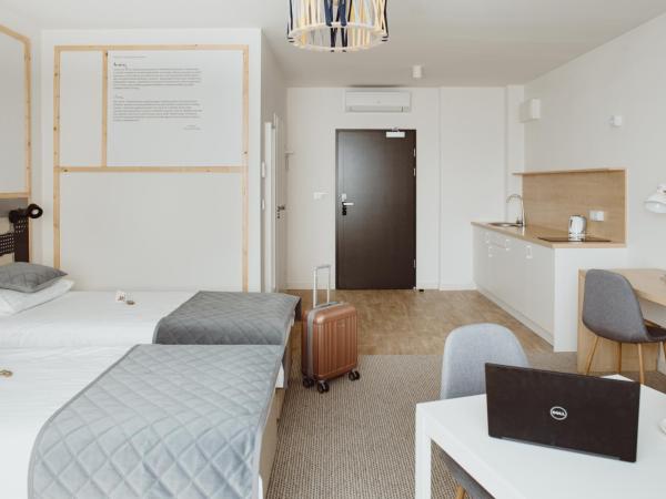 Arche Hotel Poloneza : photo 10 de la chambre chambre lits jumeaux confort