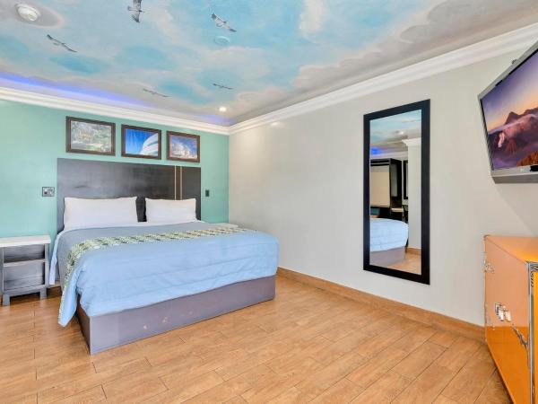 Mid City Inn : photo 7 de la chambre chambre lit king-size deluxe