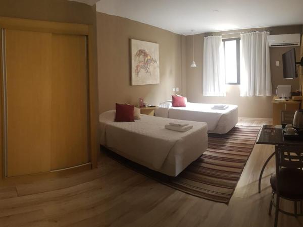 SJ Executive - San Juan Curitiba : photo 1 de la chambre suite familiale