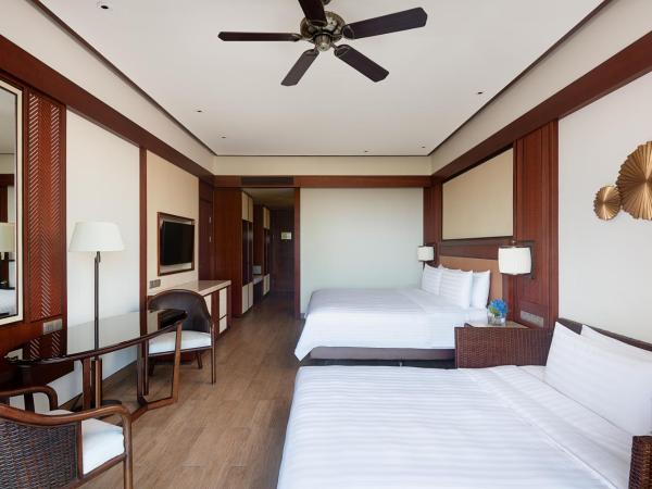 Shangri-La Sanya : photo 2 de la chambre chambre lit king-size deluxe - côté mer - vue sur jardin