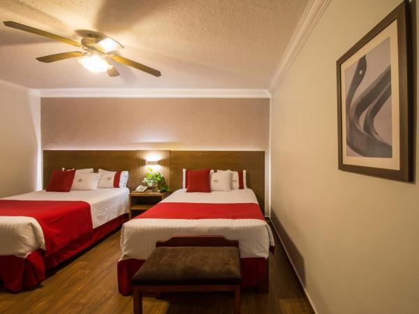 Del Marques Hotel and Suites : photo 10 de la chambre suite avec 2 lits queen-size