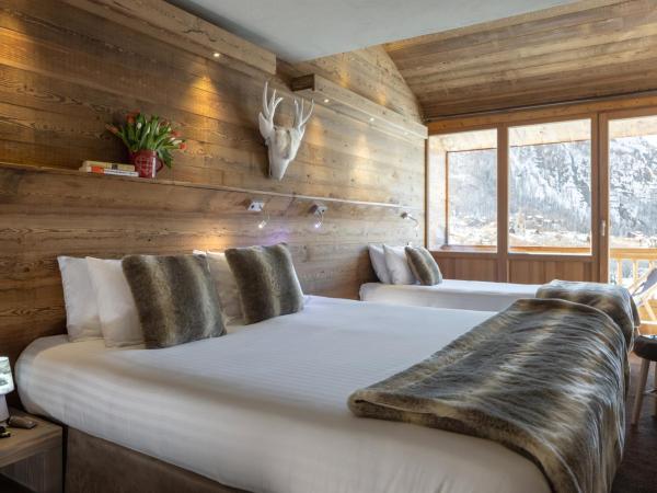 Hôtel Ski Lodge - Village Montana : photo 2 de la chambre chambre triple avec balcon - 3 adultes (13 ans et plus)