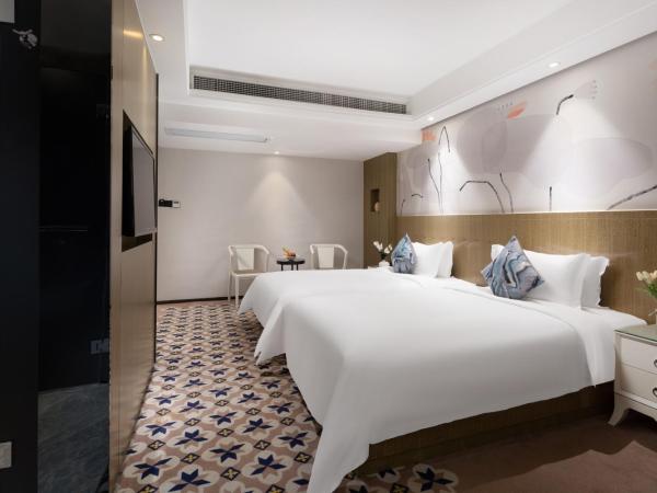 Paco Hotel Gangding Metro Guangzhou-Free Shuttle Bus during Canton Fair : photo 4 de la chambre chambre lits jumeaux supérieure sans fenêtre