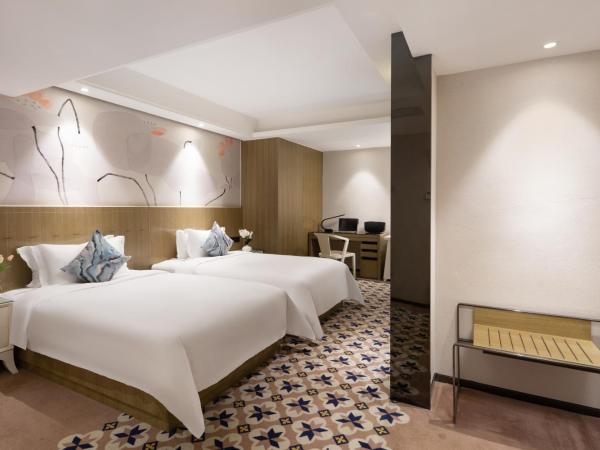 Paco Hotel Gangding Metro Guangzhou-Free Shuttle Bus during Canton Fair : photo 2 de la chambre chambre lits jumeaux supérieure sans fenêtre