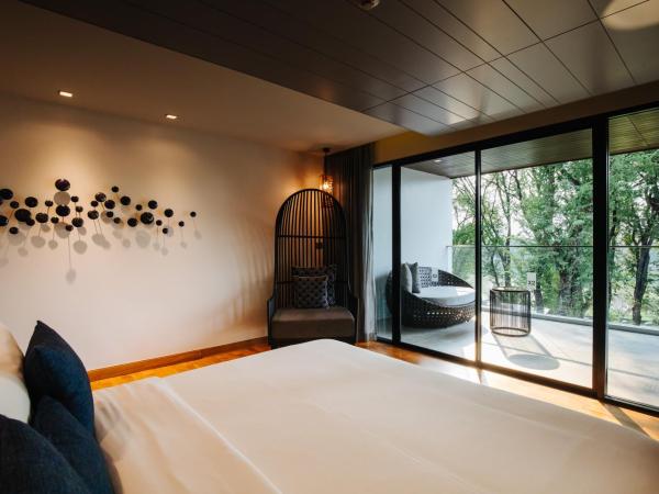 Cross Chiang Mai Riverside - formerly X2 Chiang Mai Riverside : photo 5 de la chambre grande suite avec vue sur la rivière