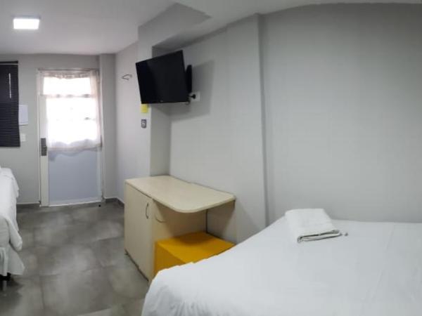 Esquina Batel - Hotel Econômico : photo 5 de la chambre chambre lits jumeaux pour personnes à mobilité réduite