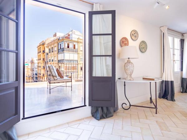 Real Casa de la Moneda Deluxe Apartments : photo 2 de la chambre penthouse