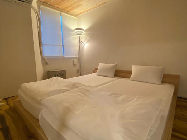 コインズホステル天神ペット宿泊可 : photo 1 de la chambre chambre lits jumeaux standard