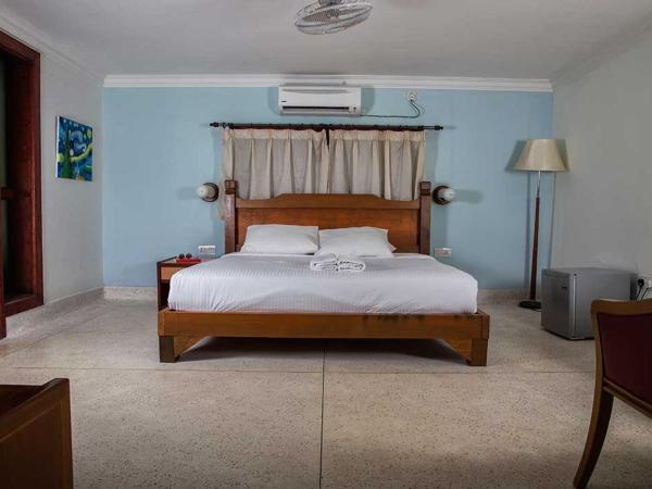 Tanjung Inn : photo 3 de la chambre chambre familiale - vue sur jardin