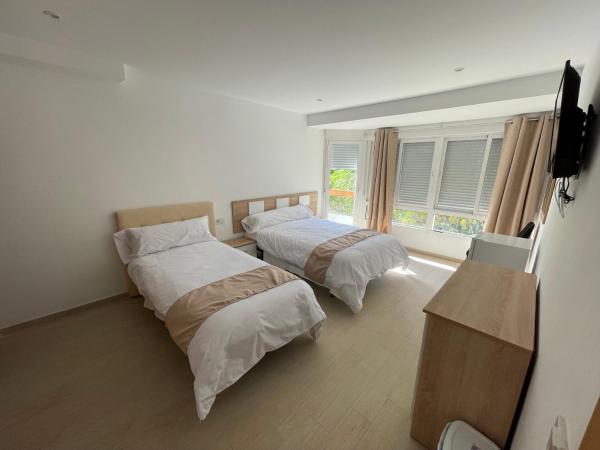 Pensión Portugal : photo 2 de la chambre chambre double ou lits jumeaux avec salle de bains commune