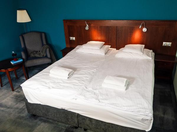 Apartamenty Siedem Komnat Siedmiu Mistrzów : photo 4 de la chambre chambre double ou lits jumeaux